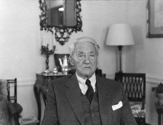 An image of John Sherman Cooper sitting for a clay bust study by John Tuska in Cooper's Washington D.C. apartment