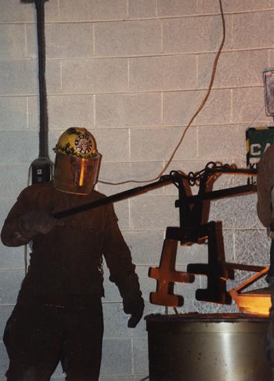 Andrew Marsh in the University of Kentucky foundry for the casting 