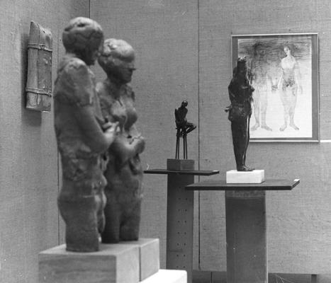 Three sculptures, a ceramic vessel and an ink drawing at an exhibit in the Spindletop Research Center