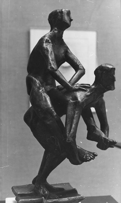 A bronze figure sculpture entitled 