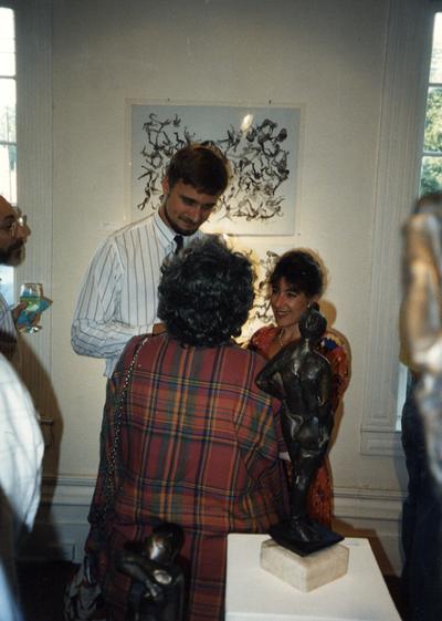 A image of unidentified persons viewing artwork at the Heike Pickett Gallery