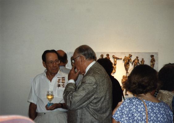 A image of unidentified persons viewing artwork at the Heike Pickett Gallery