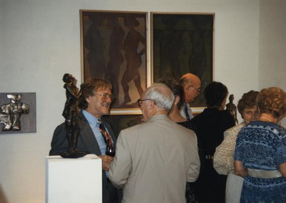 A image of unidentified persons viewing artwork at the Heike Pickett Gallery