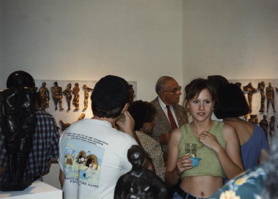 A image of unidentified persons viewing artwork at the Heike Pickett Gallery