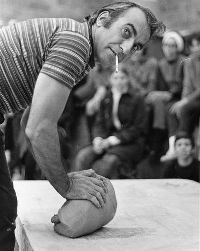 Artist Peter Voulkos demonstrates wedging clay for a class at the University of Kentucky. John Tuska was in attendance