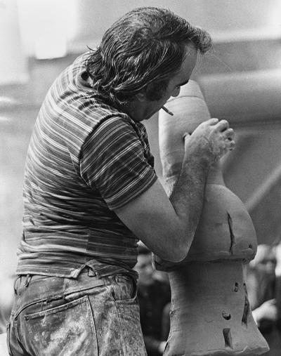 Artist Peter Voulkos works on a ceramic vessel for a class at the University of Kentucky. John Tuska was in attendance