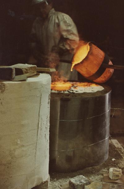 John Tuska pouring for a cast at the University of Kentucky foundry. The photograph was taken by Ted Bronda